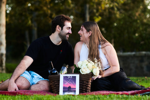 Cupid's Arrow Founders sitting at a picnic together. Founder Story